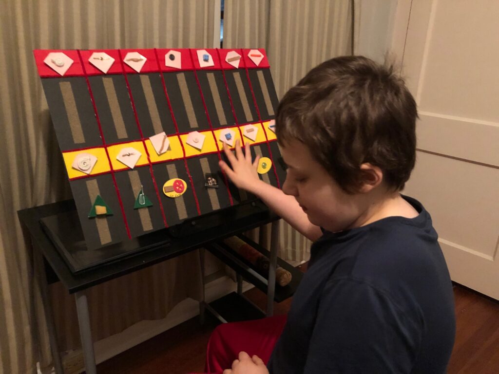 Eddie interacting with a tactile calendar