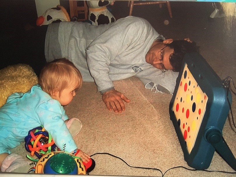 Baby on the floor looking at object