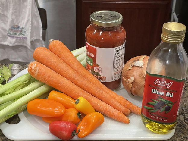 pictured: pasta sauce, assorted vegetables and pasta.