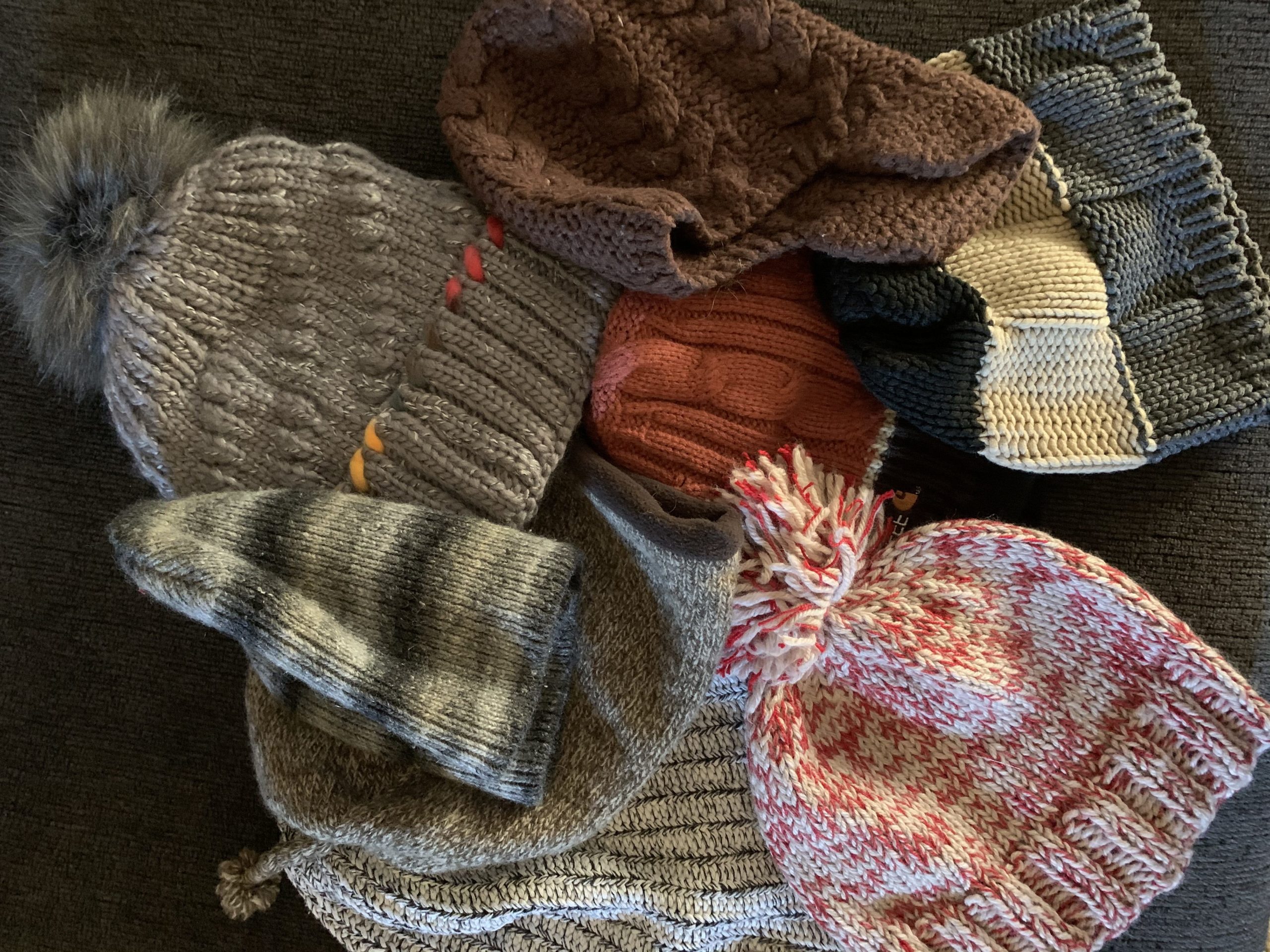 A pile of knitted hats