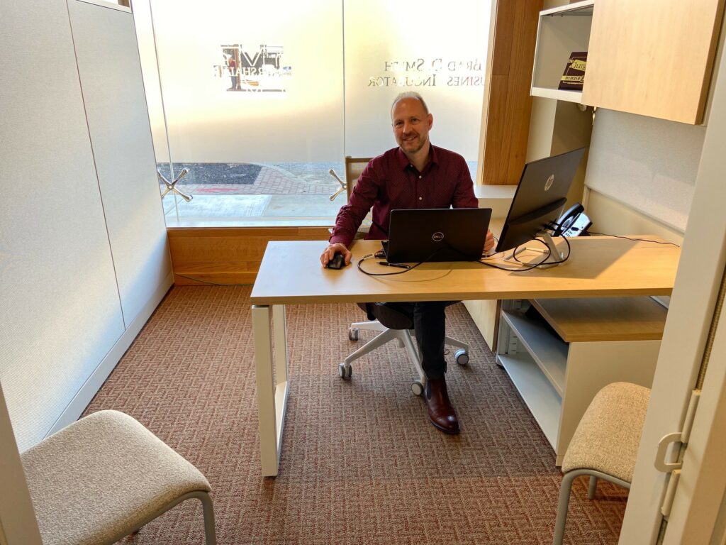 Individual sitting at an office desk